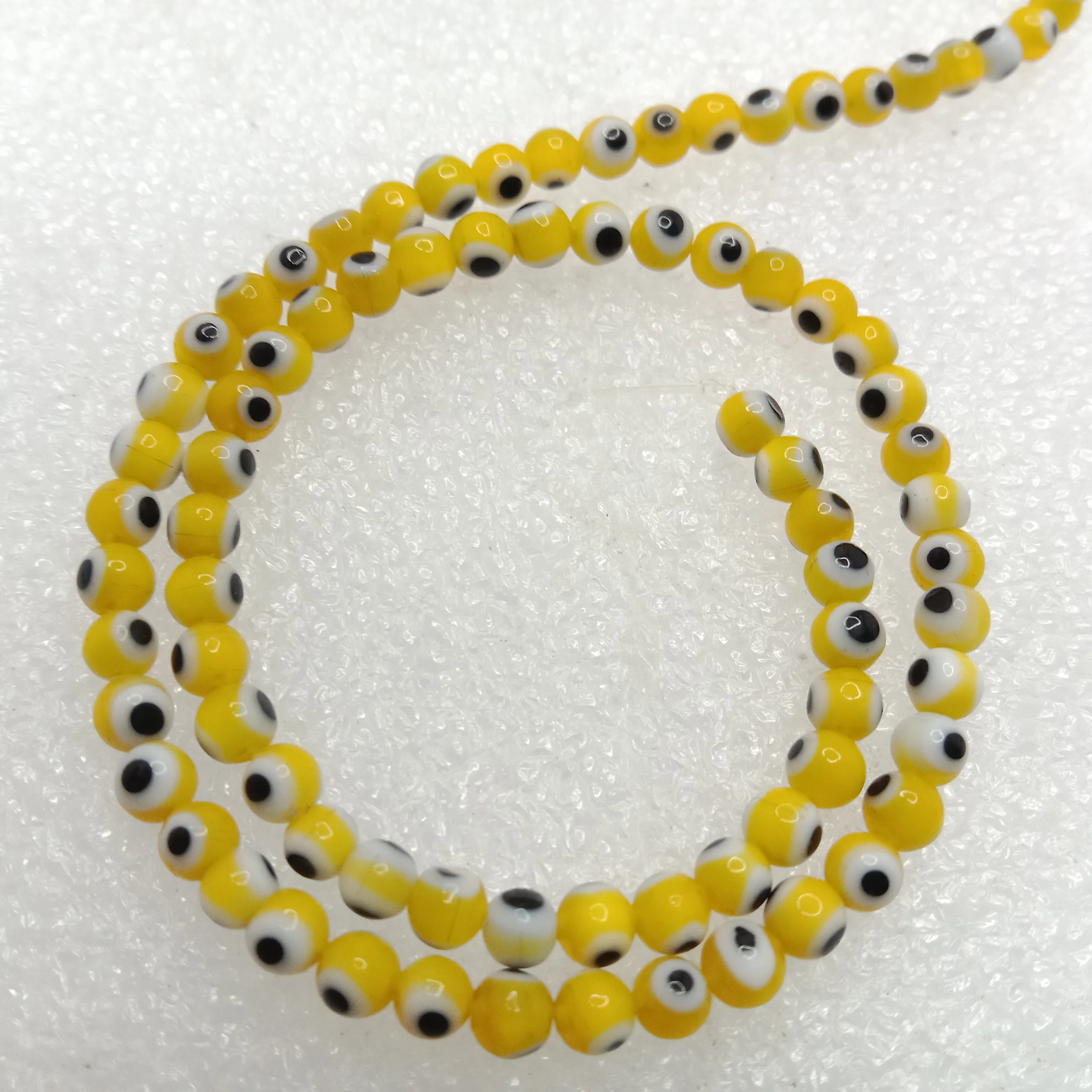 Yellow Evil eye round shape beads 4mm 1 string