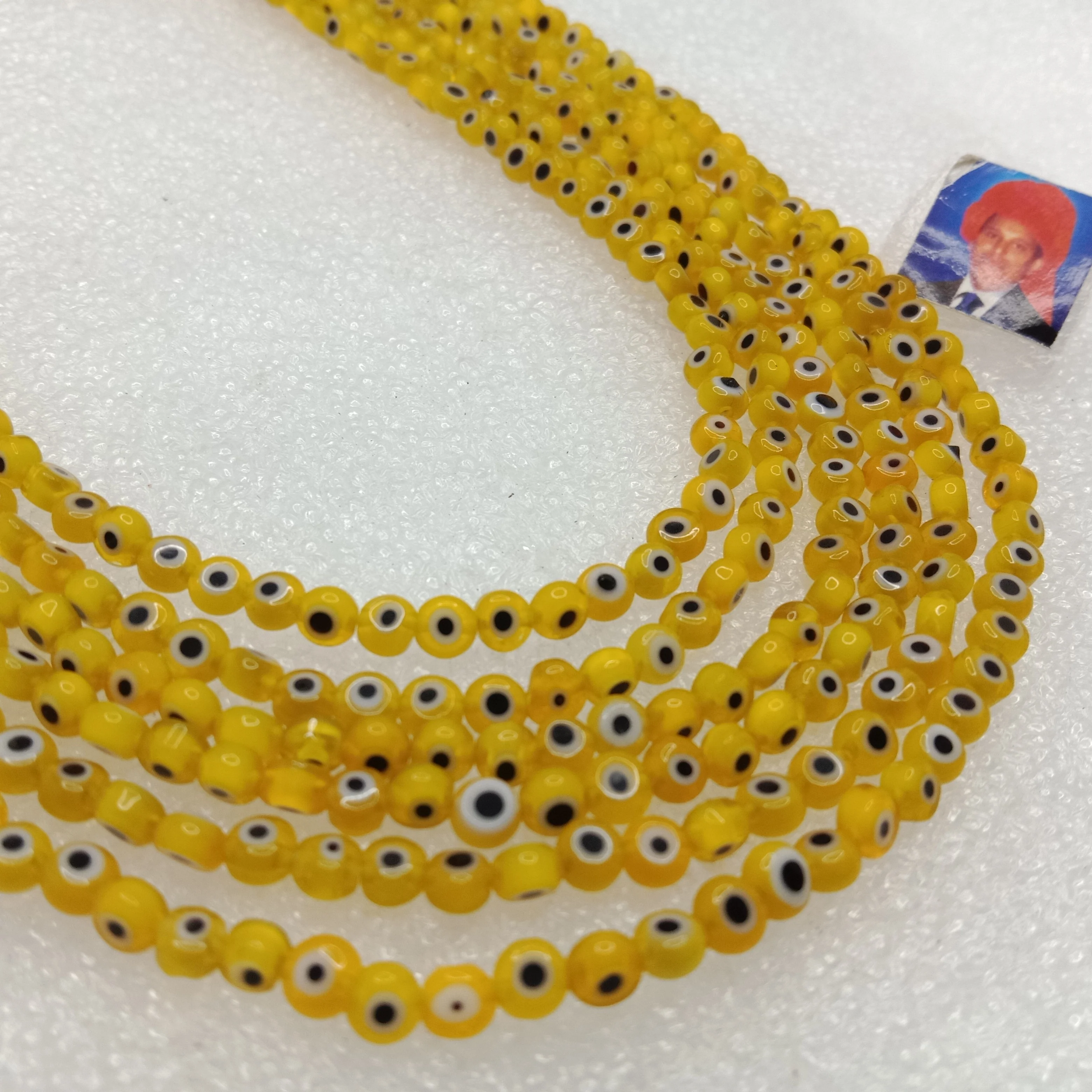 Yellow Evil eye flat shape beads 4mm 1 string