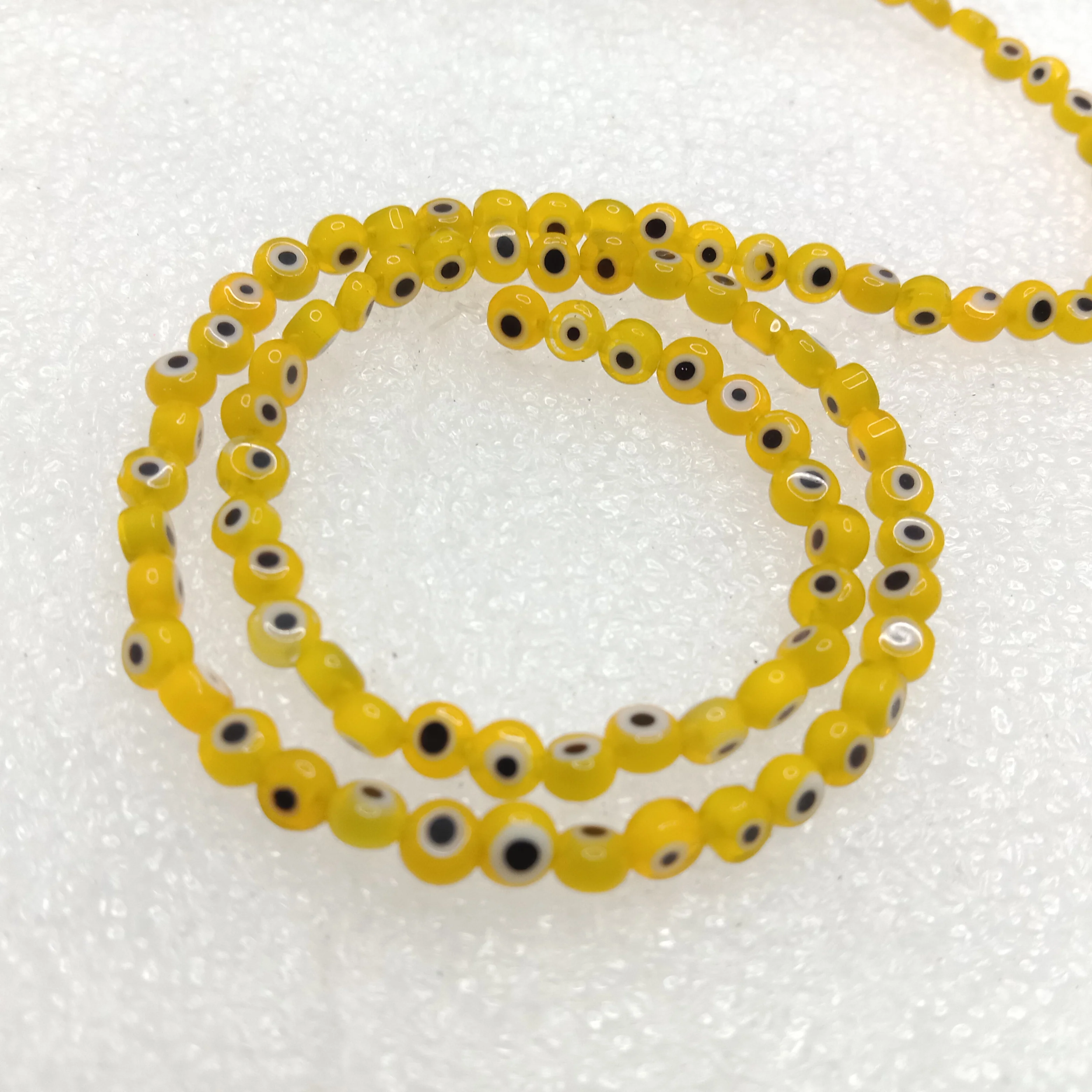 Yellow Evil eye flat shape beads 4mm 1 string