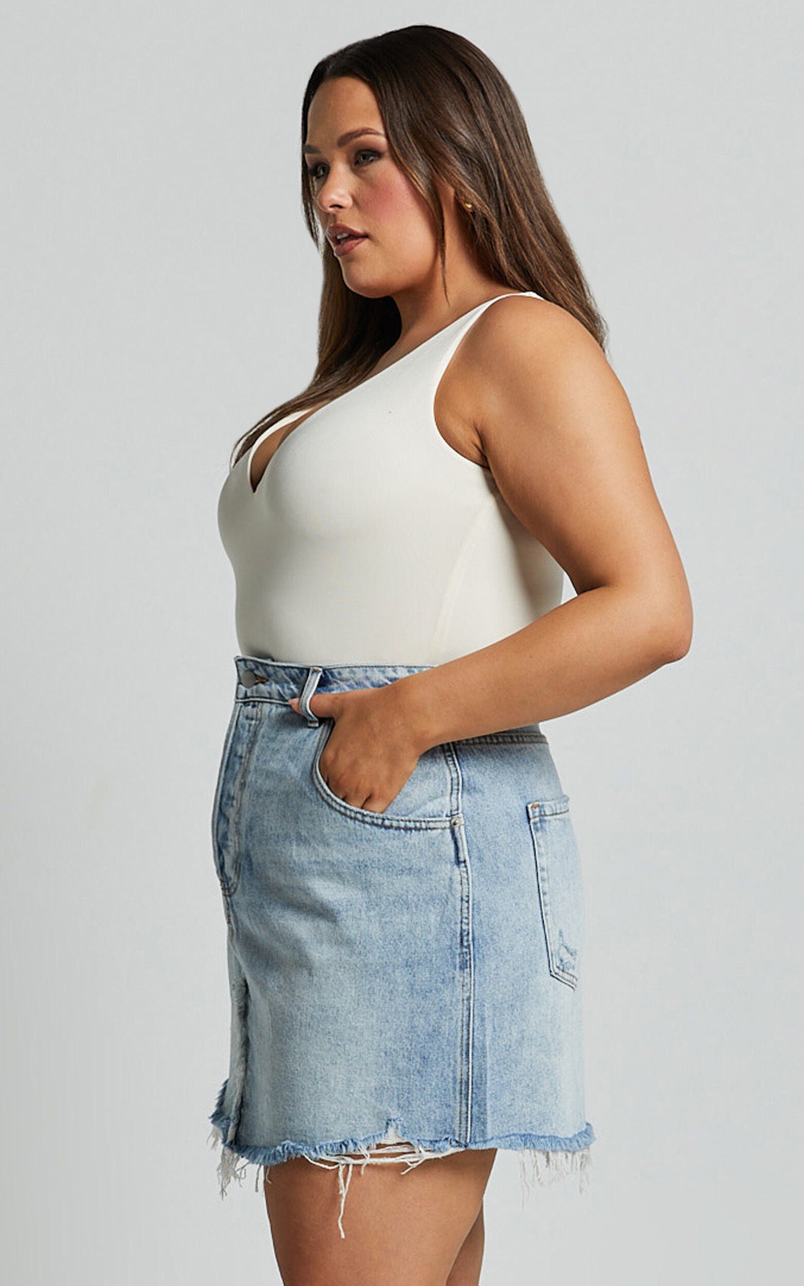 Pieta Mini Skirt - Recycled Cotton Raw Hem Denim Skirt in Mid Blue Wash