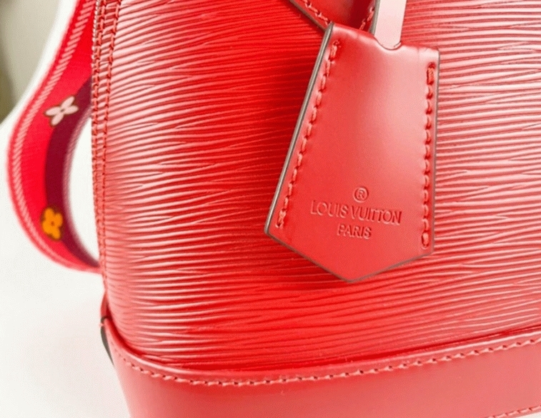 Louis Vuitton Epi Leather Alma BB Handbag In Red With Jacquard Strap
