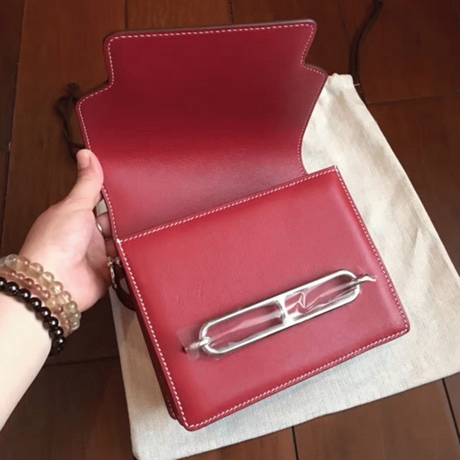 Red designer replica Hermes Mini Sac Roulis handbag