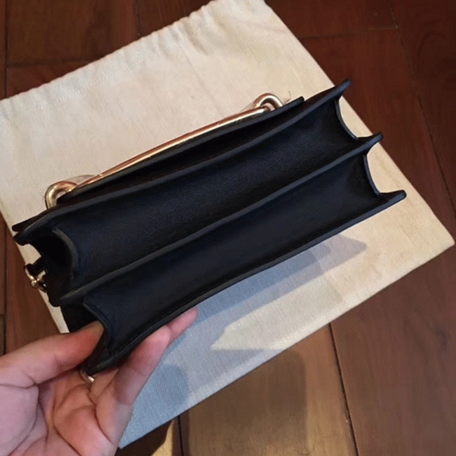 Black knockoff Hermes Mini Sac Roulis handbag