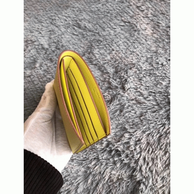 Yellow knockoff Hermes Copernic compact wallet