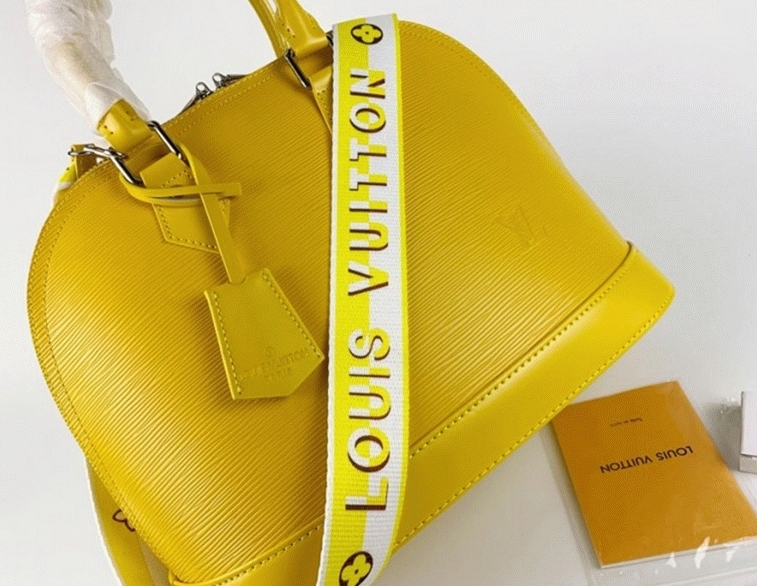 Louis Vuitton Epi Leather Alma PM Handbag In Cedrat Yellow With Jacquard Strap