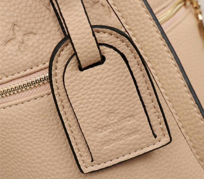 Louis Vuitton Monogram Empreinte Melie Hobo In Beige