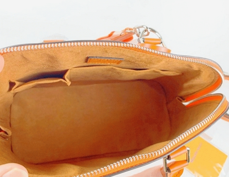 Louis Vuitton Epi Leather Alma PM Handbag In Orange With Jacquard Strap