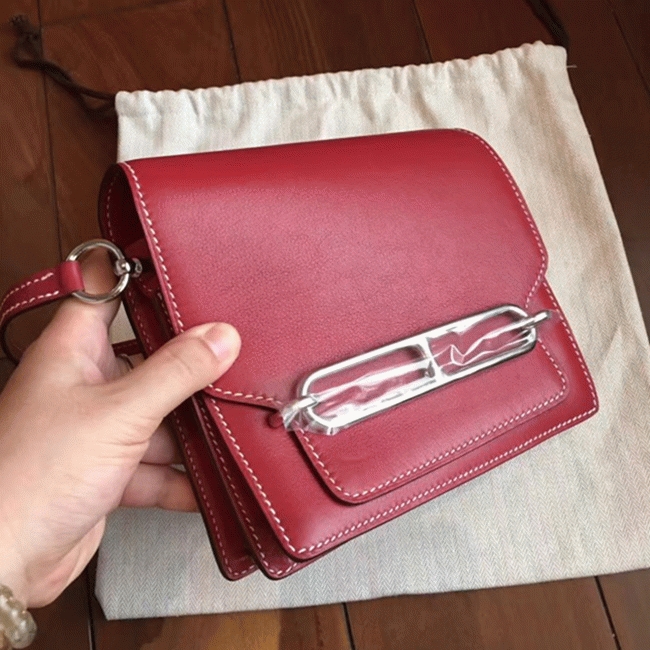 Red designer replica Hermes Mini Sac Roulis handbag