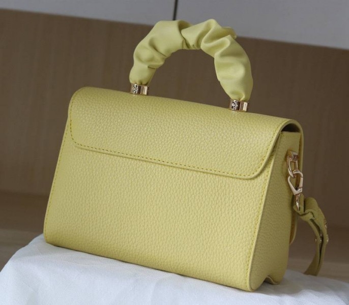 Louis Vuitton Taurillon Leather Twist MM Scrunchie Handle In Ginger Yellow