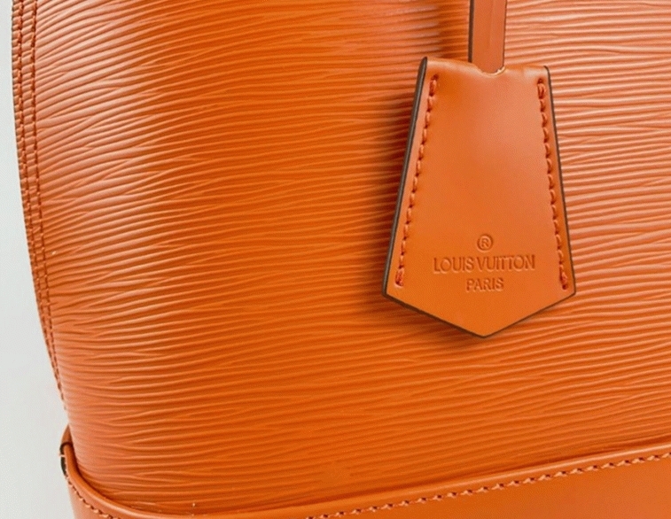 Louis Vuitton Epi Leather Alma PM Handbag In Orange With Jacquard Strap