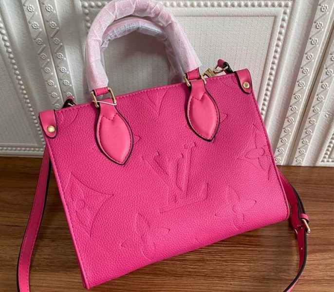 Louis Vuitton Monogram Empreinte Leather Onthego PM Bag In Freesia Pink