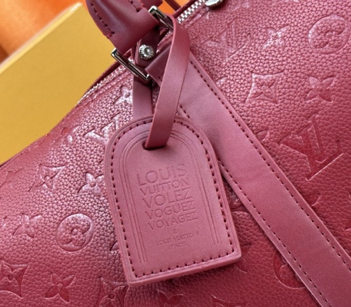 Louis Vuitton Taurillon Leather Keepall Bandouliere 50 In Sari Red