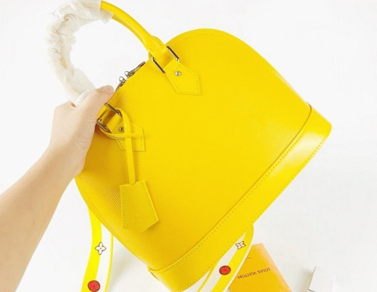 Louis Vuitton Epi Leather Alma PM Handbag In Cedrat Yellow With Jacquard Strap