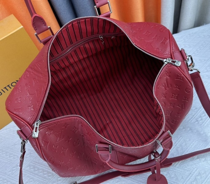 Louis Vuitton Taurillon Leather Keepall Bandouliere 50 In Sari Red