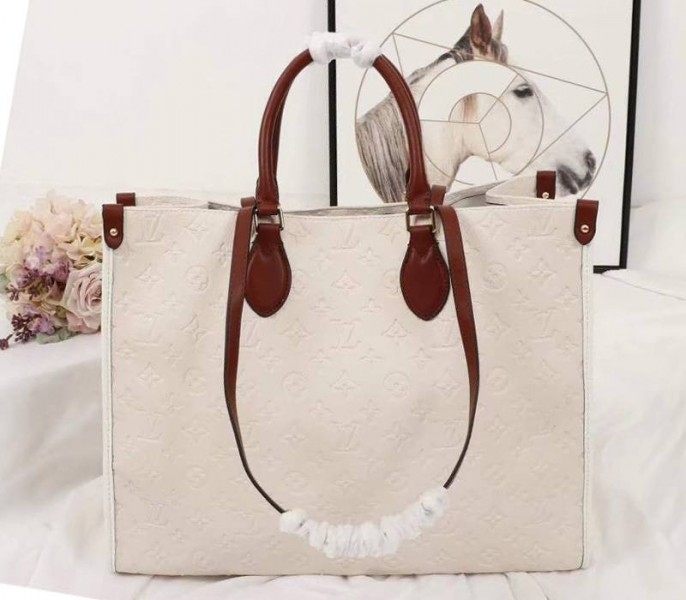 Louis Vuitton Monogram Empreinte Onthego GM Tote In Cream
