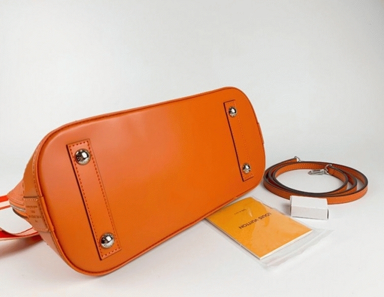Louis Vuitton Epi Leather Alma PM Handbag In Orange With Jacquard Strap