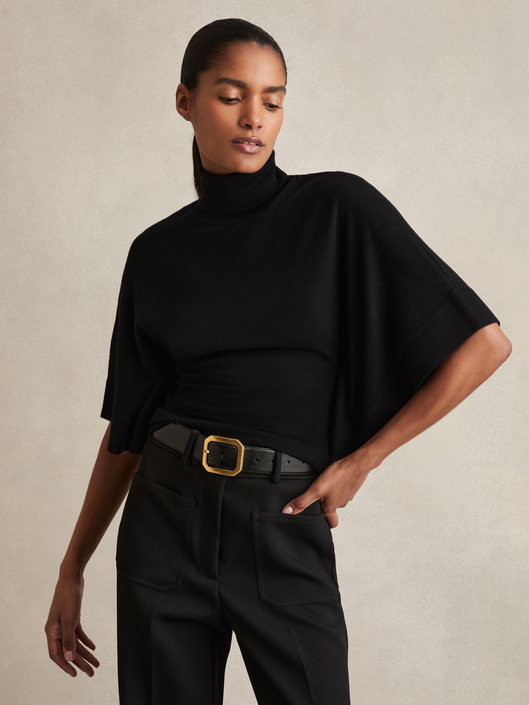 Merino Wool Batwing Roll-Neck Jumper in Black