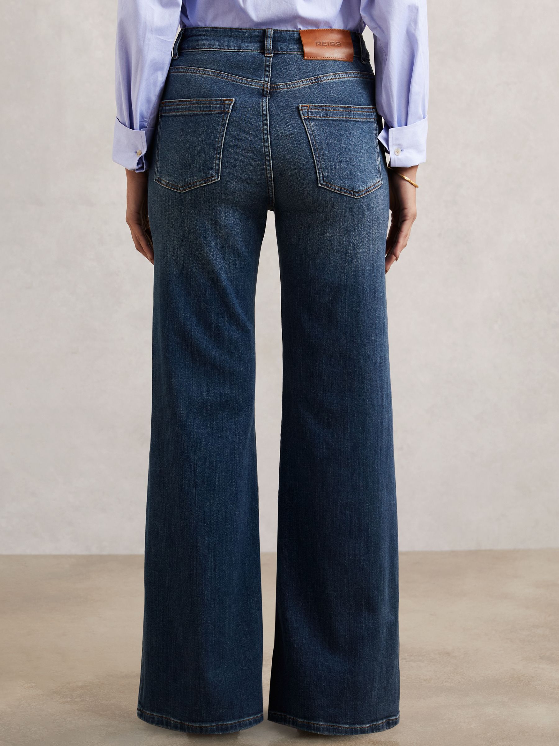 Petite Mid-Rise Flared Jeans in Mid Blue