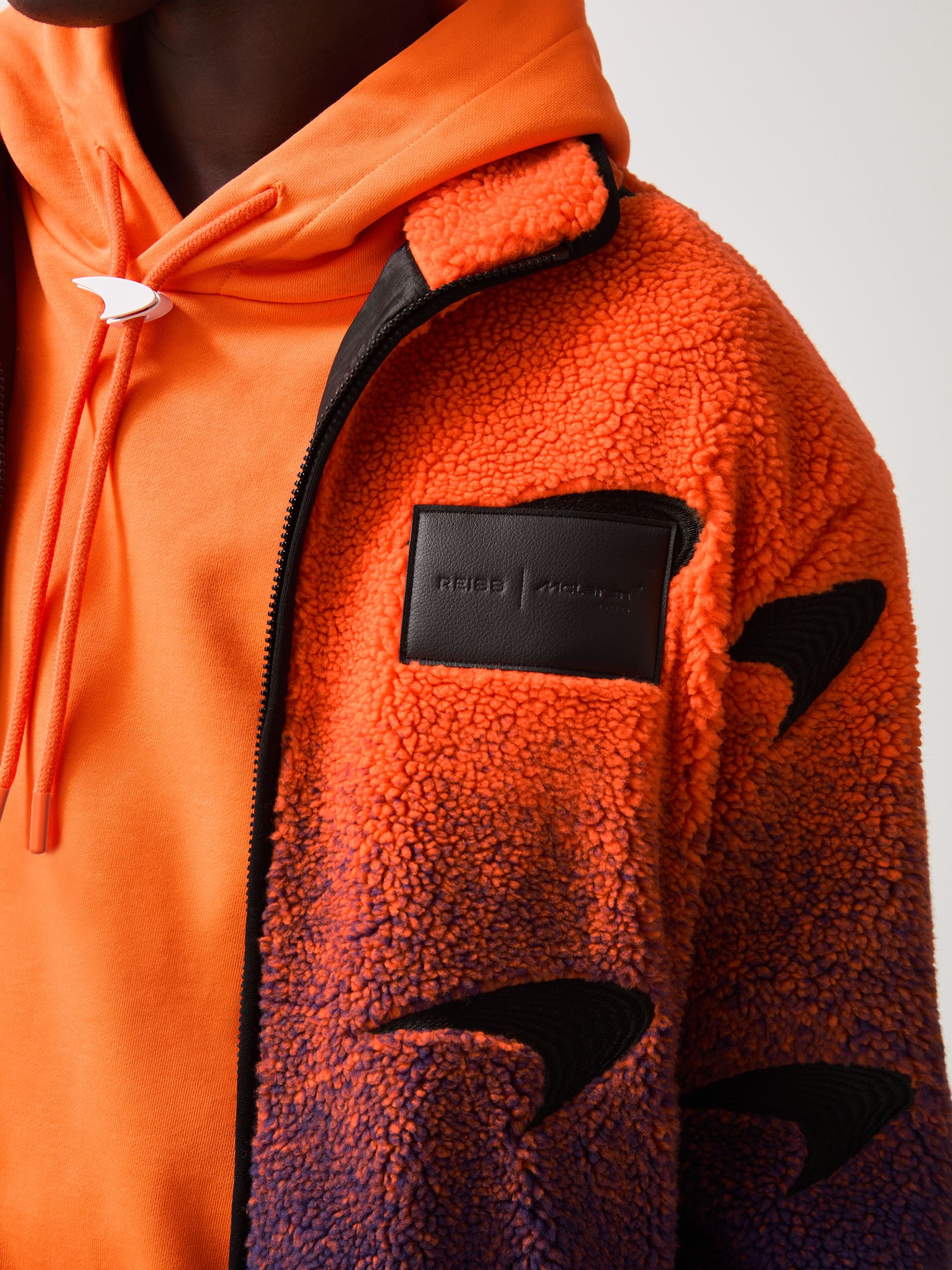 Unisex Fit McLaren F1 Team Ombré Fleece Jacket in Papaya Orange/Purple