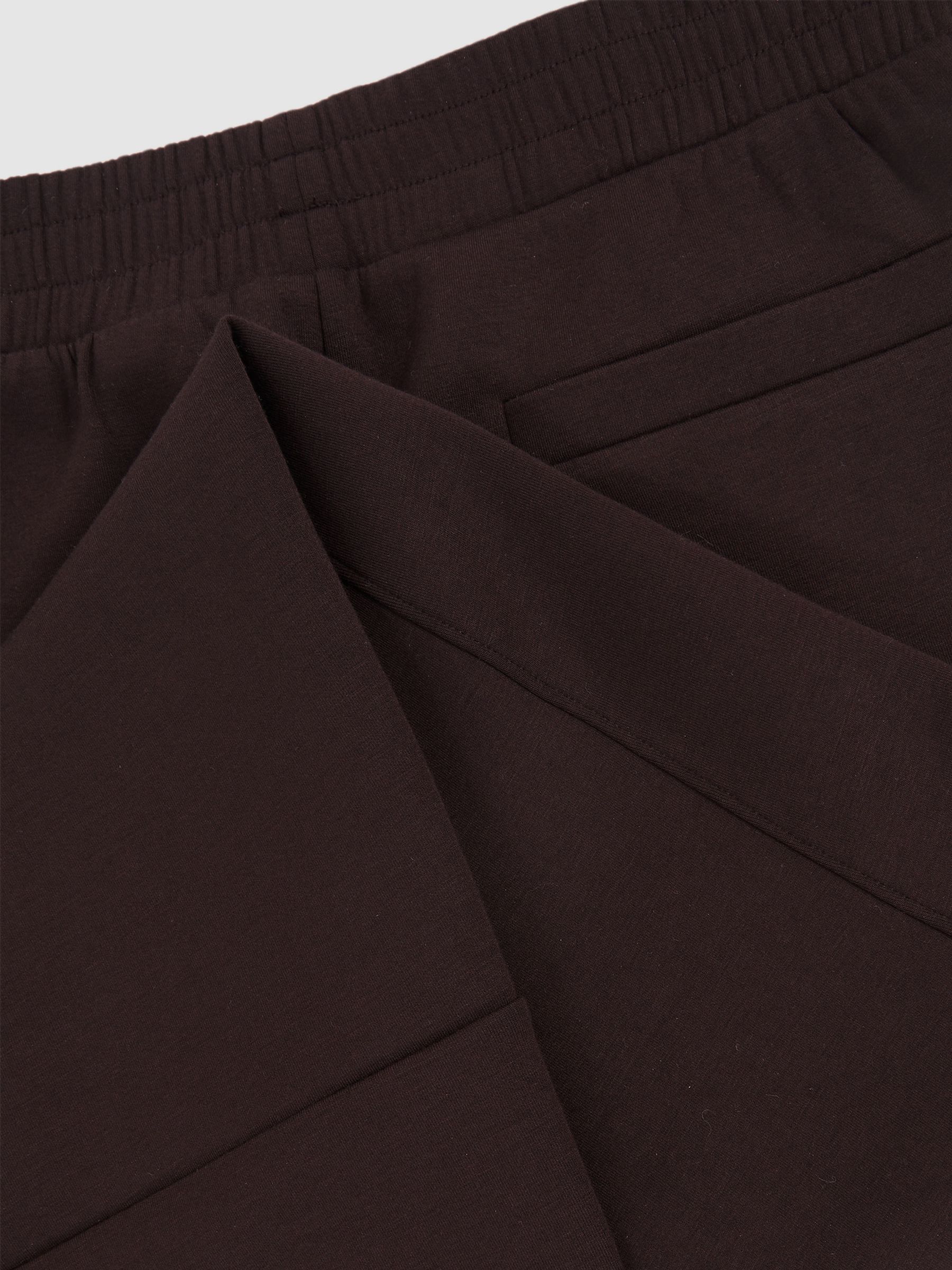 Interlock Tapered Joggers in Plum