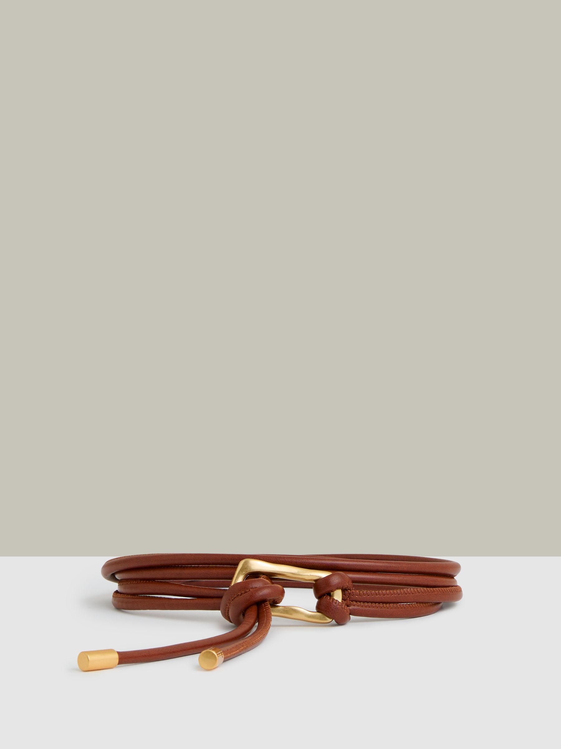 Sculpted Buckle Tubular Tie Belt in Tan
