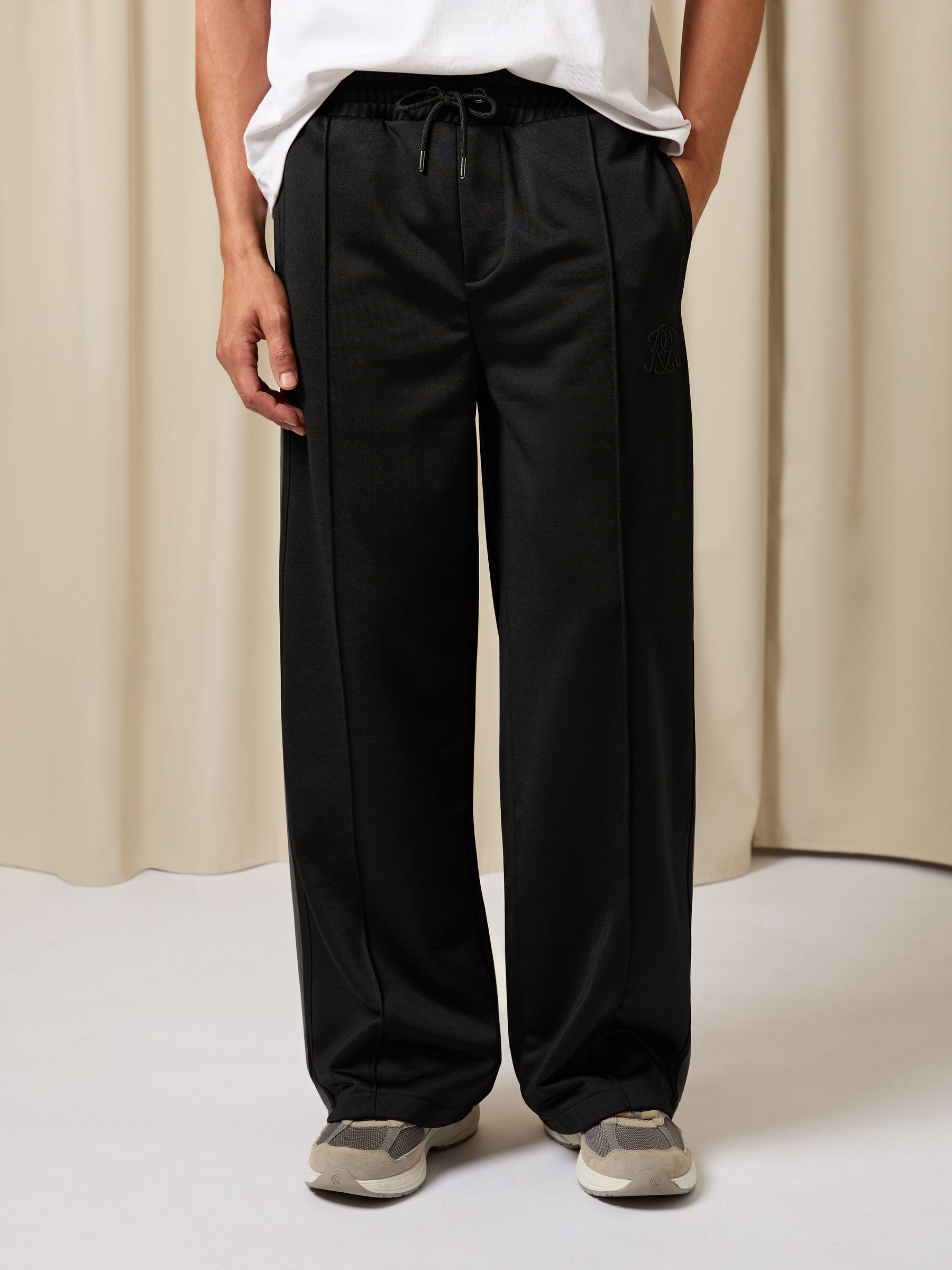 Monogram Cotton Wide-Leg Joggers in Black