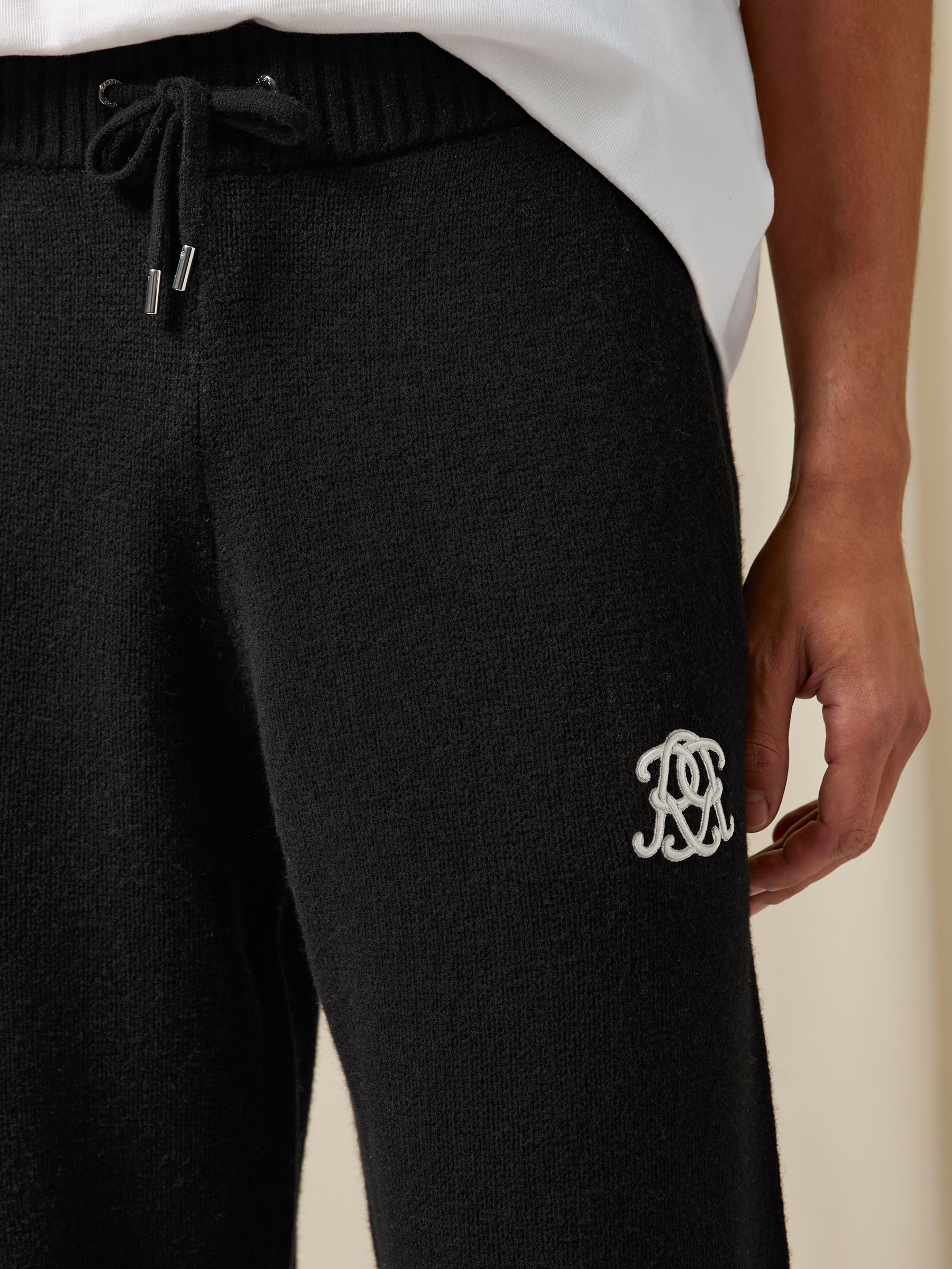 Monogram Wool Wide-Leg Knitted Joggers in Black