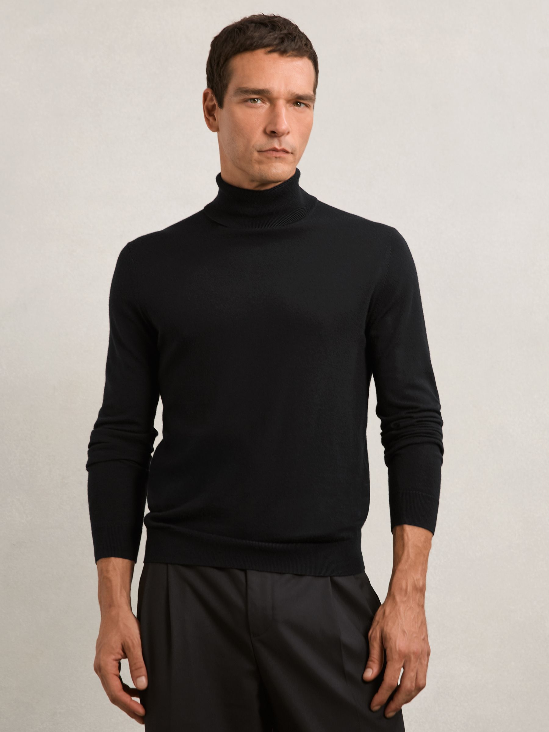 Merino Wool Roll-Neck Jumper in Black