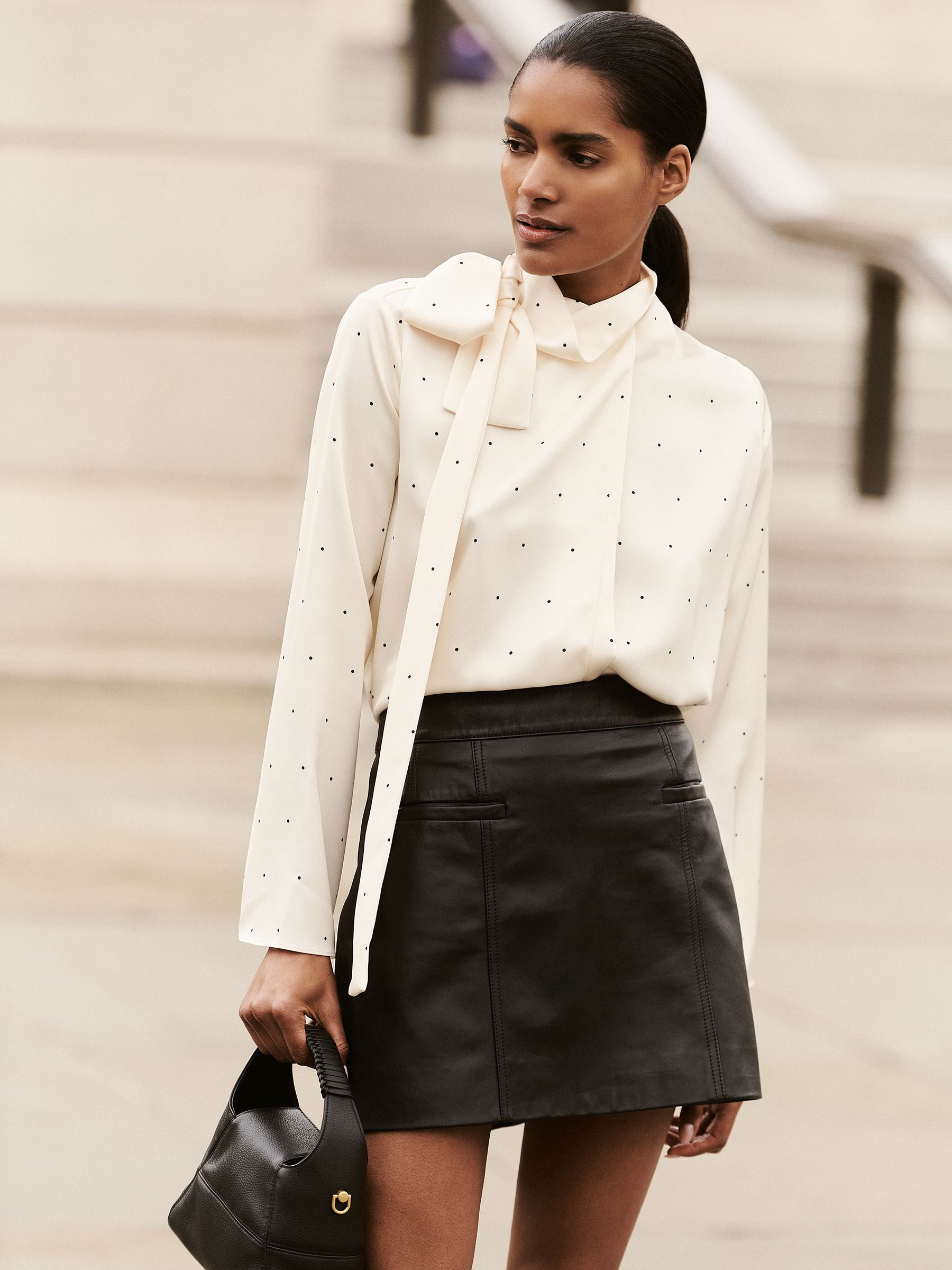 Leather Welt-Pocket Mini Skirt in Black