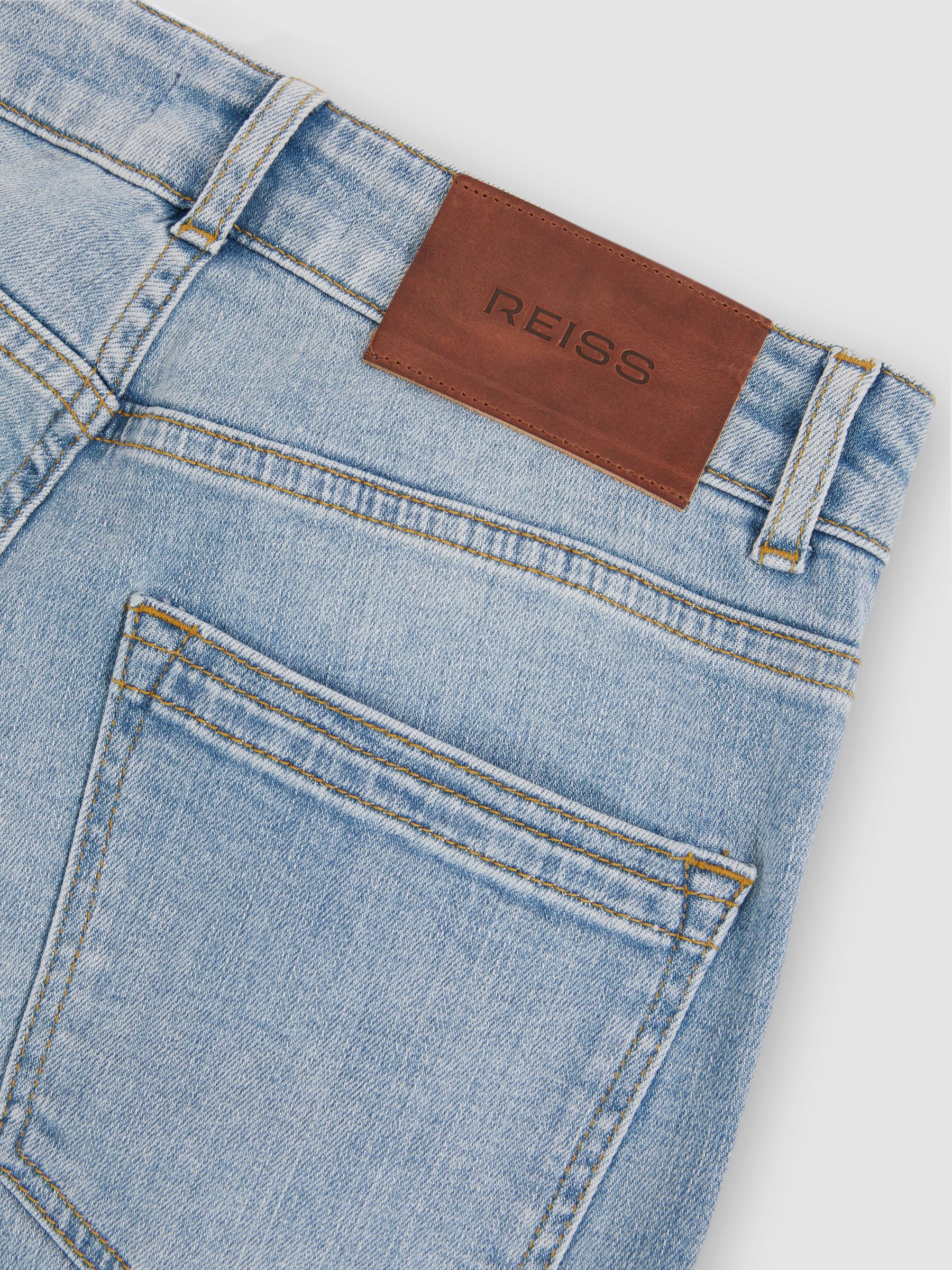 Petite Mid-Rise Flared Jeans in Light Blue