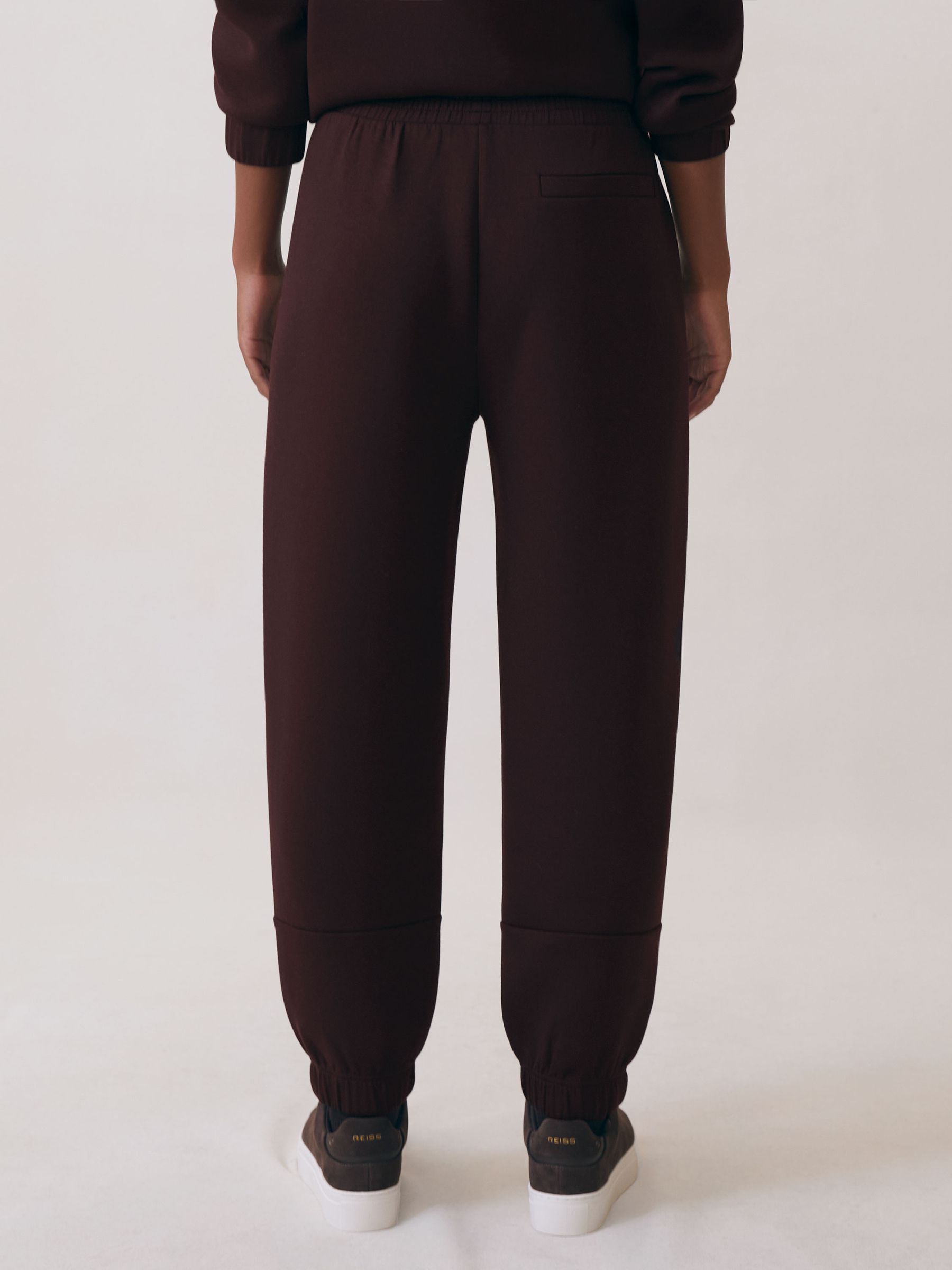 Interlock Tapered Joggers in Plum