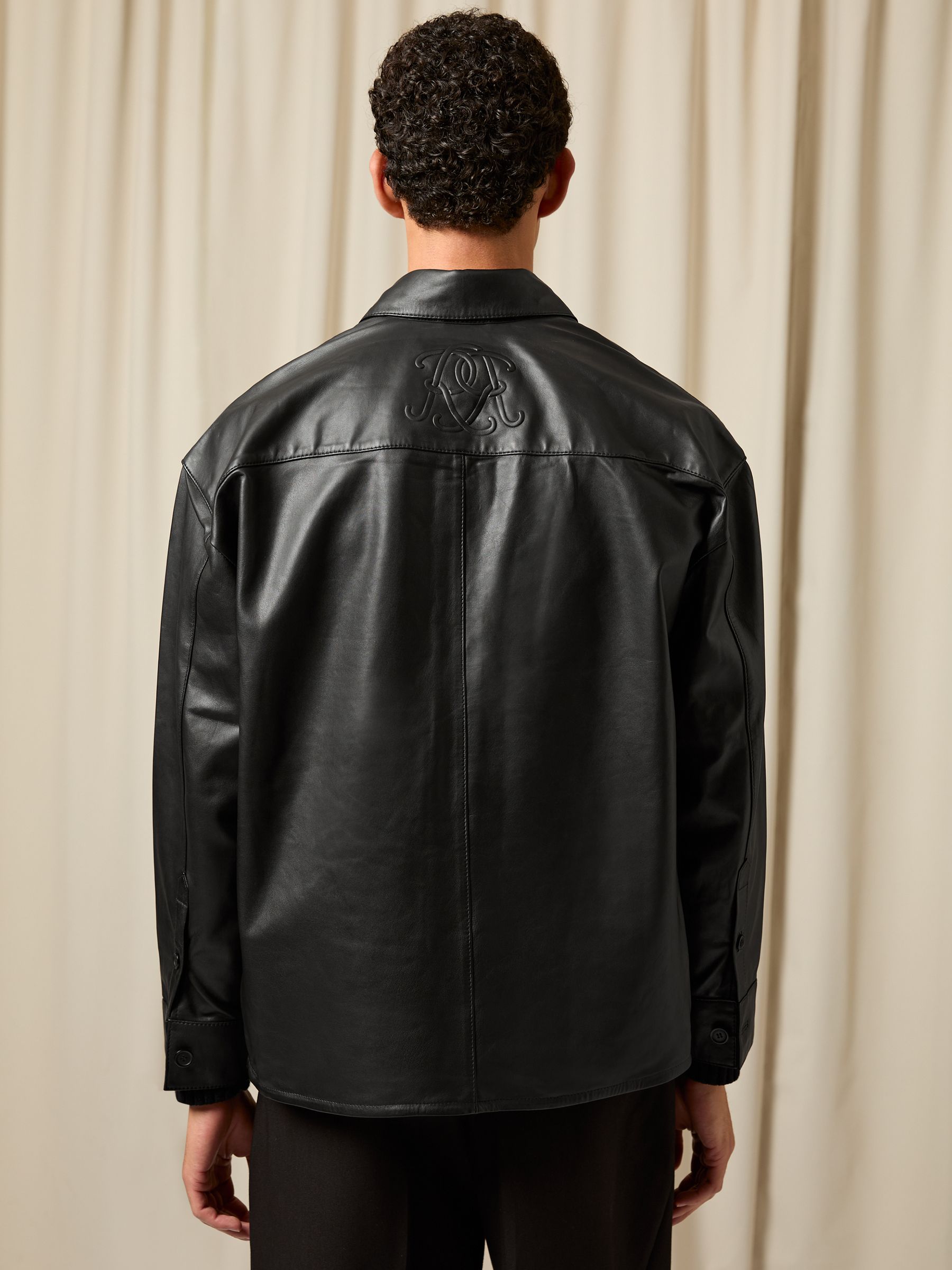 Monogram Embossed Leather Jacket in Black
