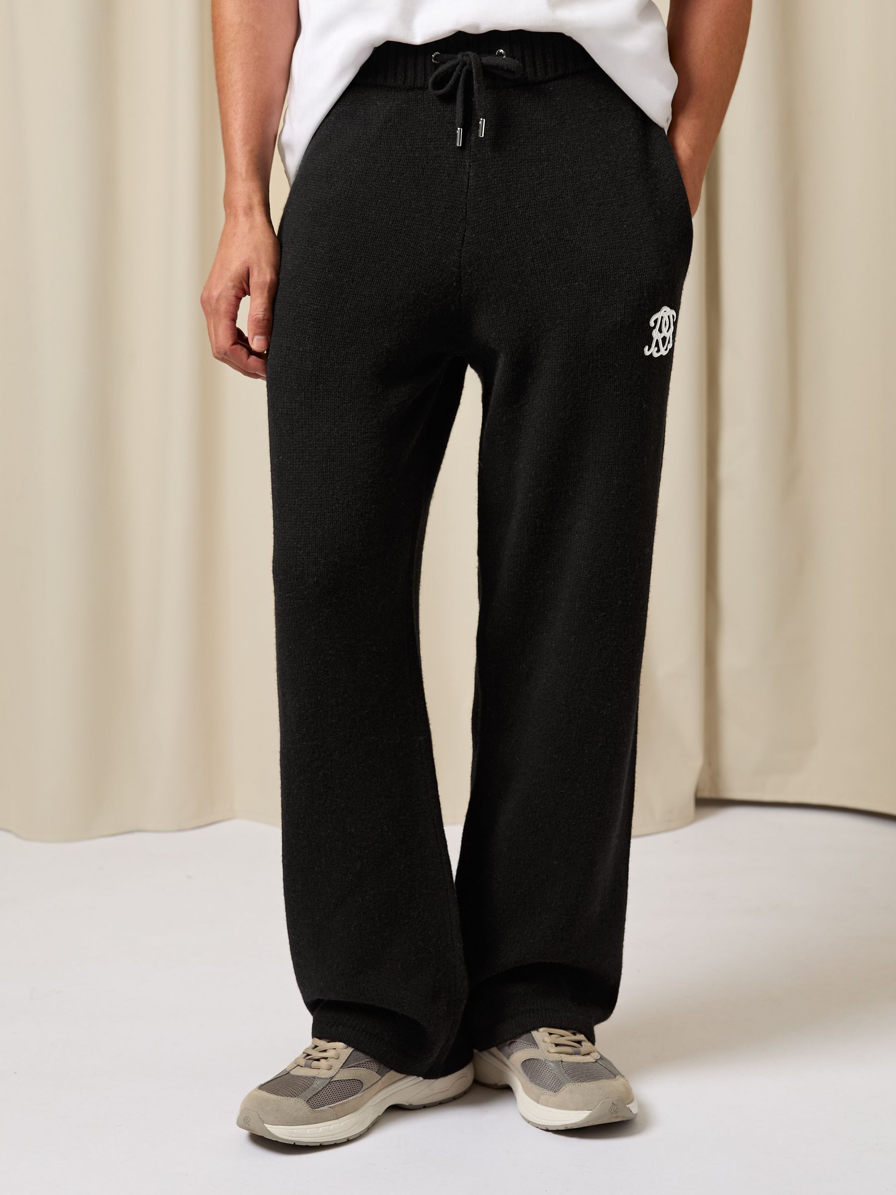 Monogram Wool Wide-Leg Knitted Joggers in Black