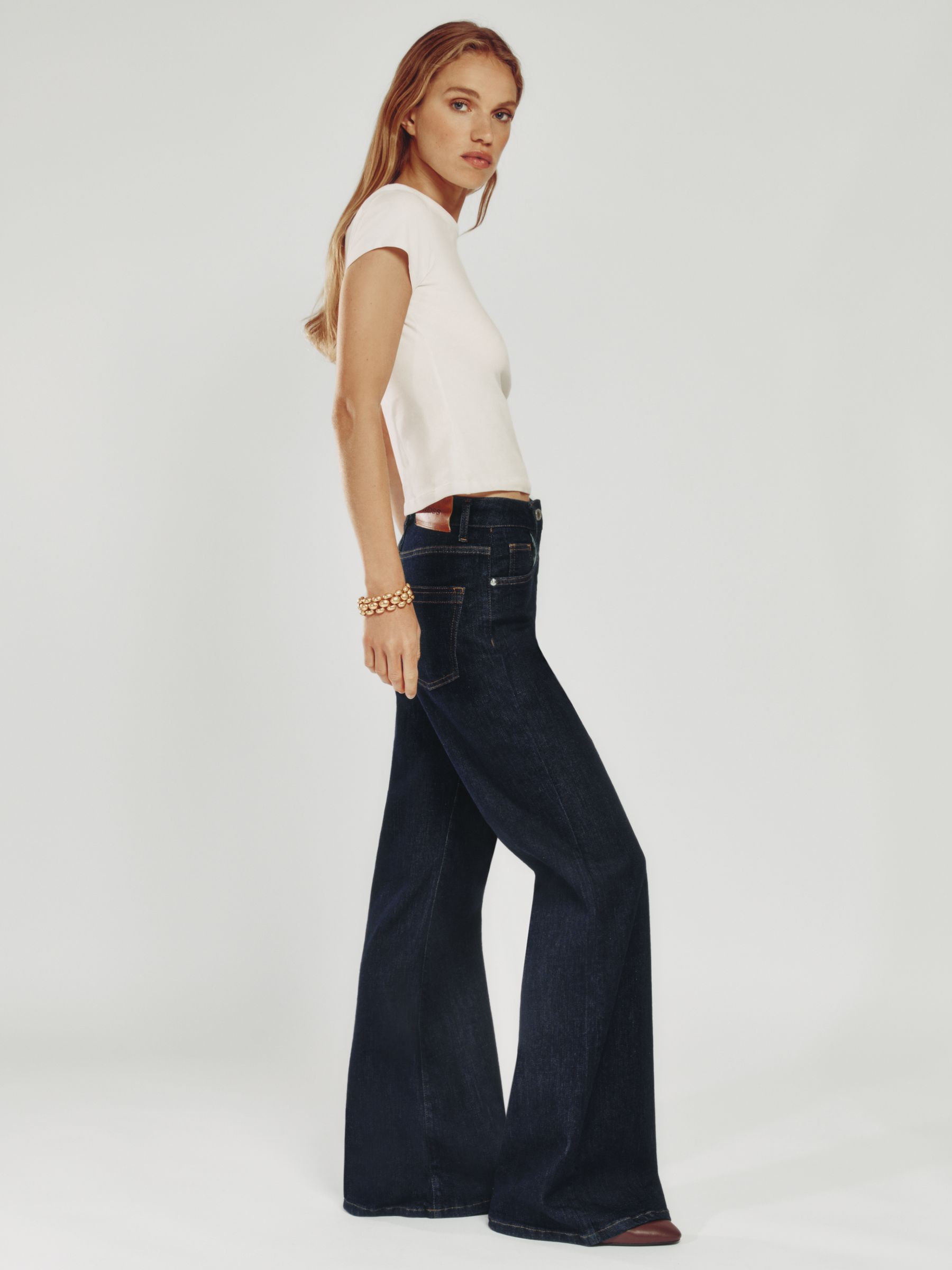 Petite Mid-Rise Flared Jeans in Mid Blue