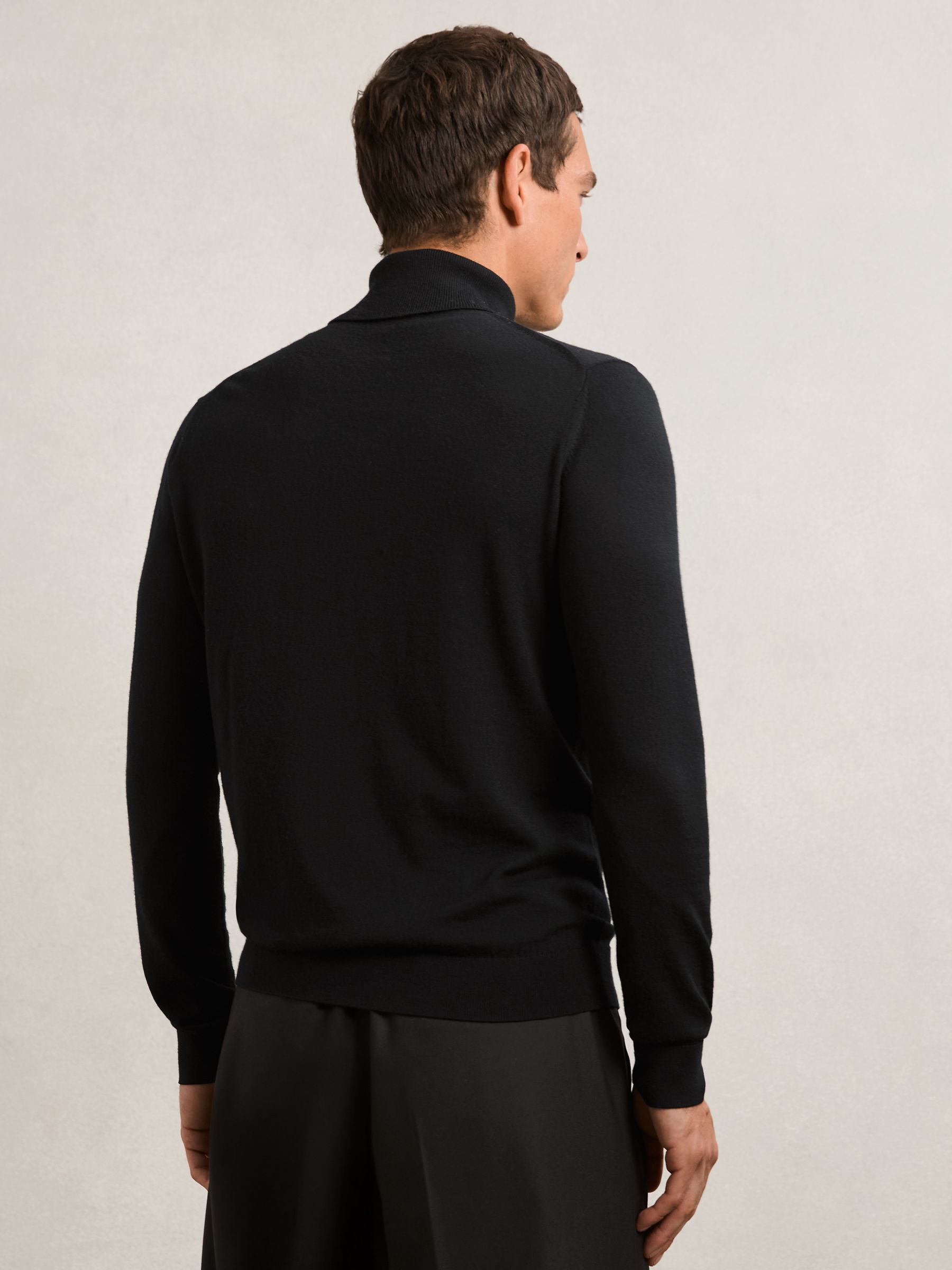 Merino Wool Roll-Neck Jumper in Black