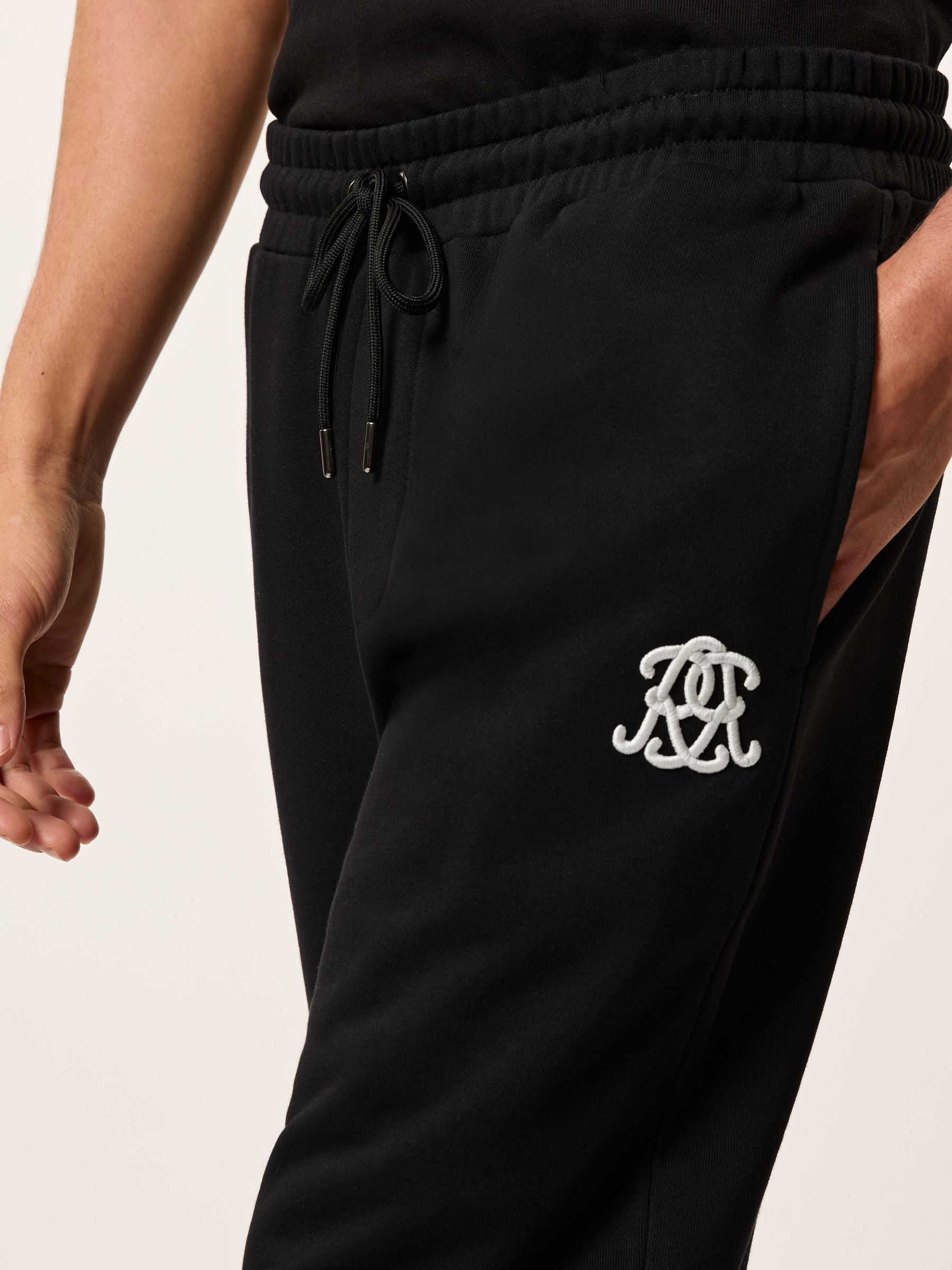 Monogram Cotton Wide-Leg Joggers in Black