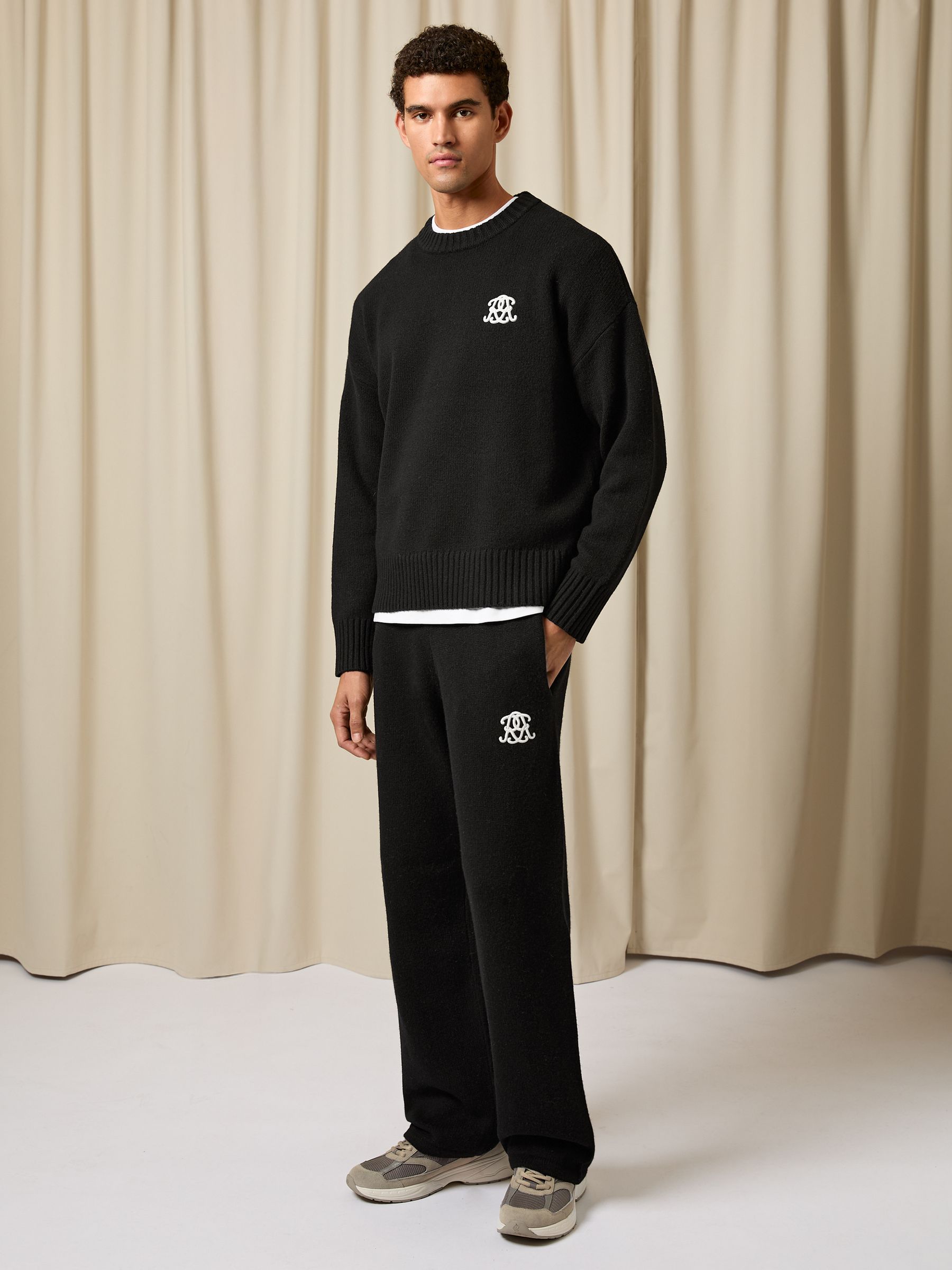 Monogram Wool Wide-Leg Knitted Joggers in Black