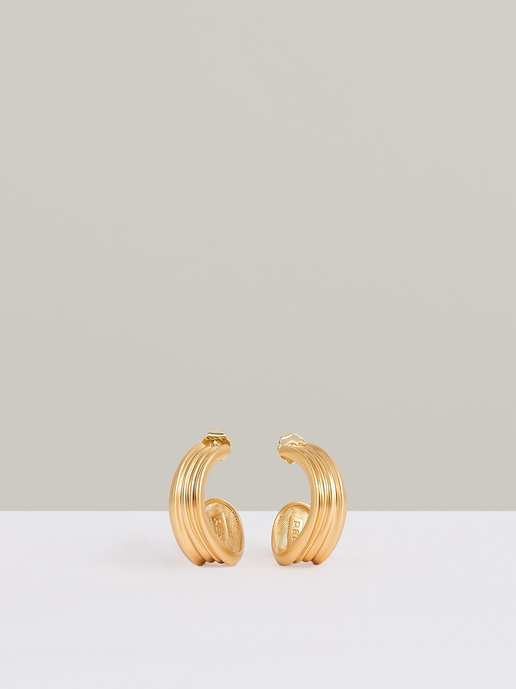 Fluid Hoop Earrings in Gold Tone