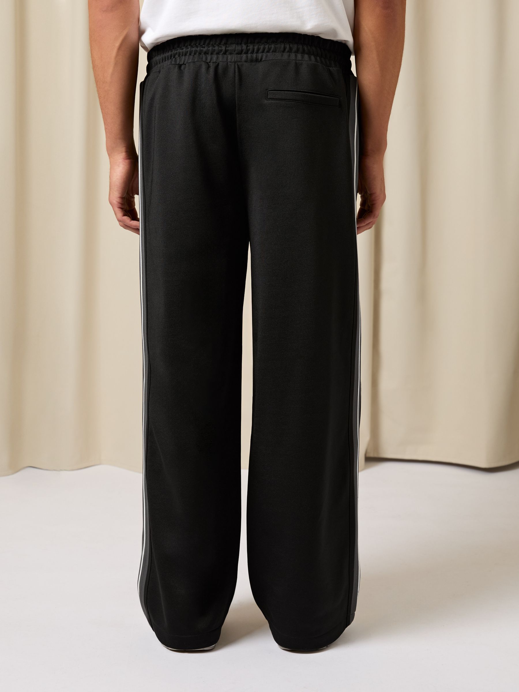 Monogram Cotton Wide-Leg Joggers in Black