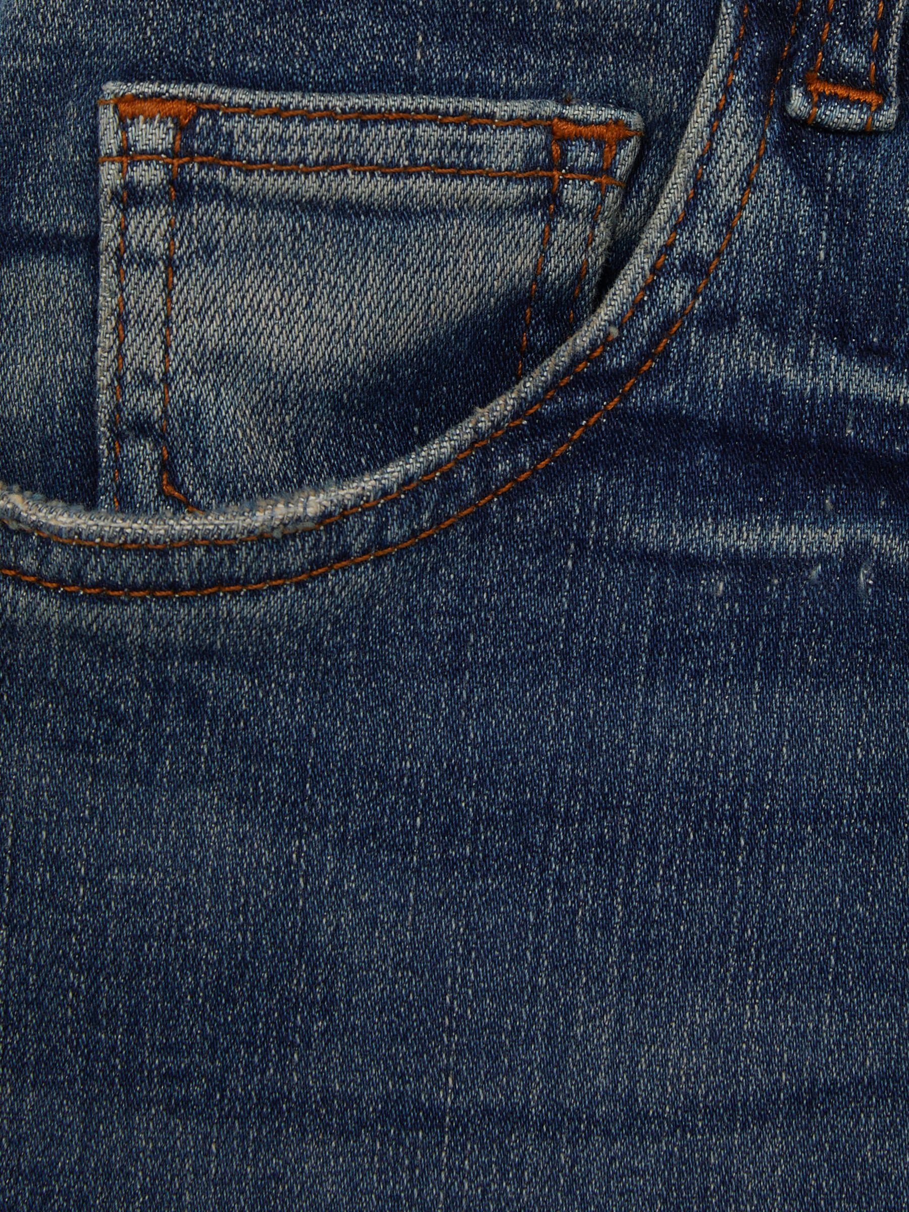 Petite Mid-Rise Flared Jeans in Mid Blue