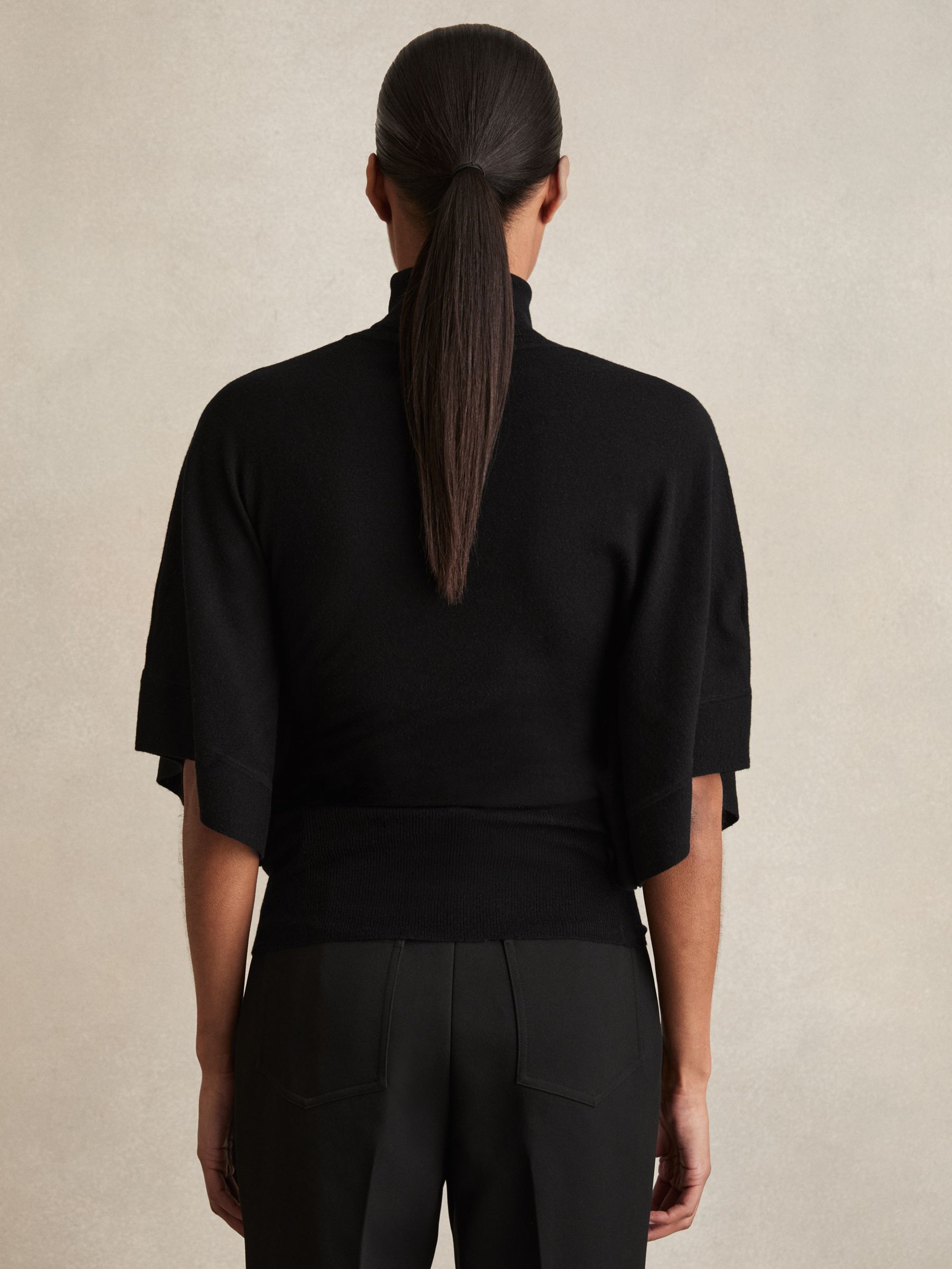 Merino Wool Batwing Roll-Neck Jumper in Black