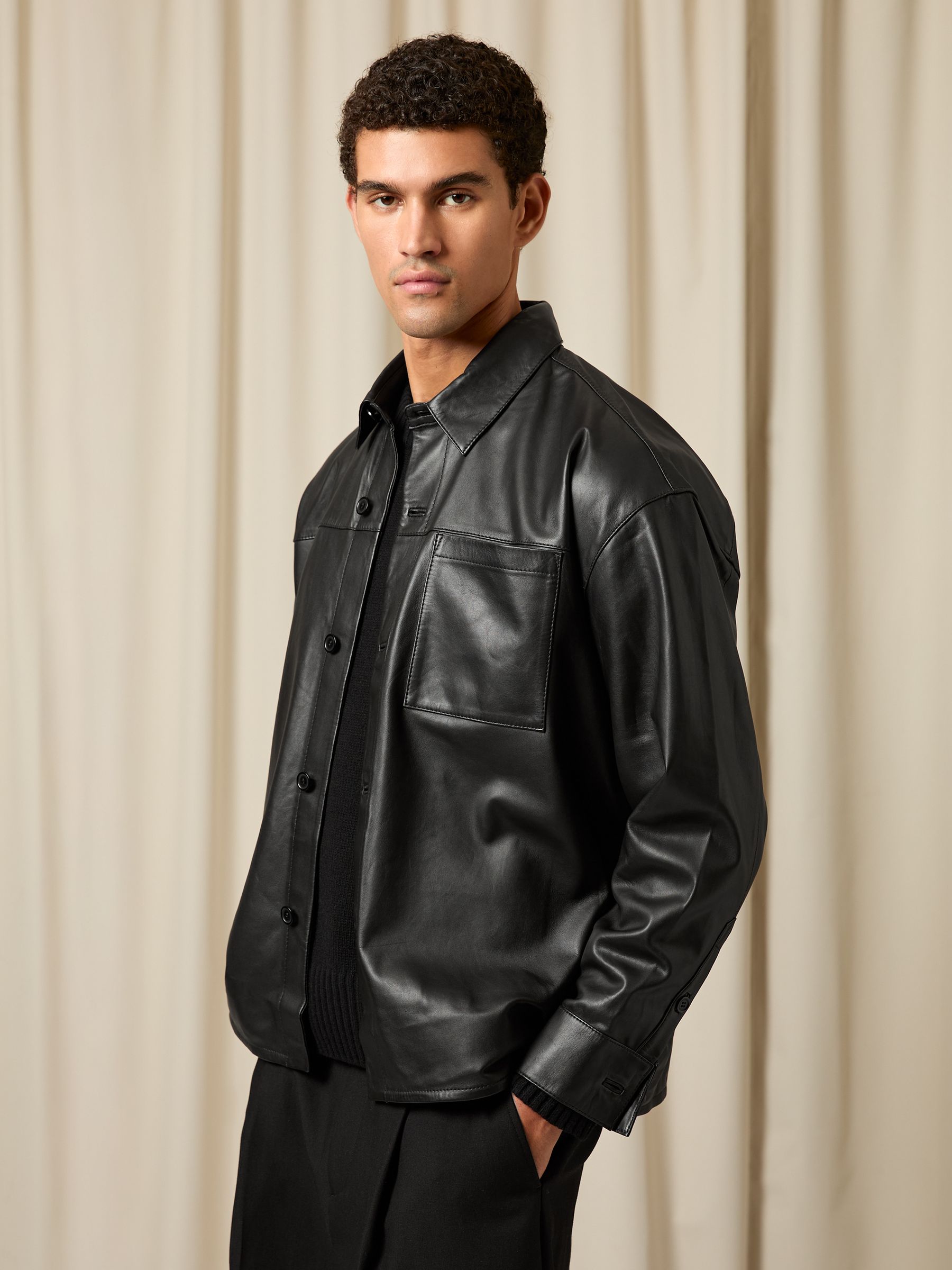 Monogram Embossed Leather Jacket in Black