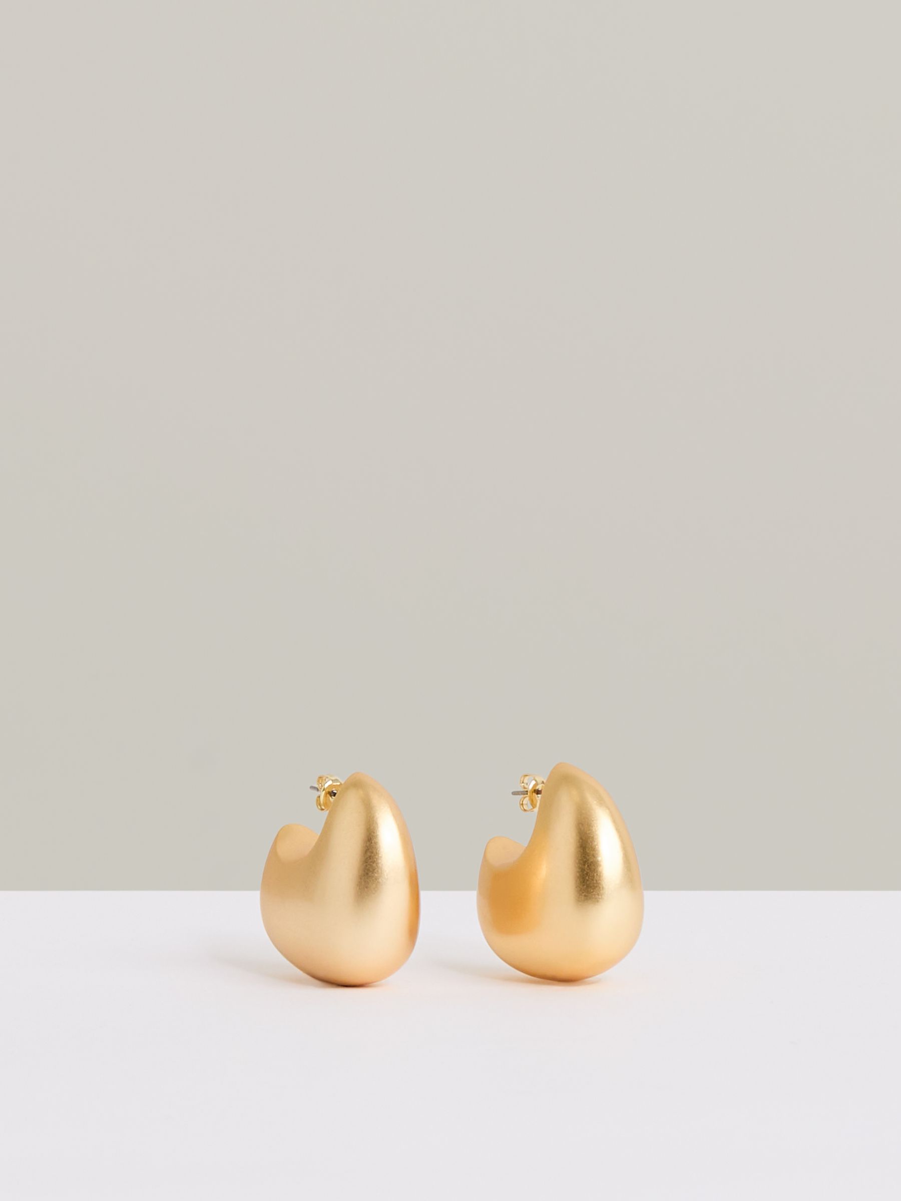 Curve Scoop Earrings in Gold Tone